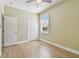 This is an empty bedroom with a window and a closet at 9709 Bay Colony Dr, Riverview, FL 33578