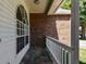 Charming covered front porch with brick accents and a stone pathway leading to the entrance at 9709 Bay Colony Dr, Riverview, FL 33578