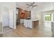 Open-concept kitchen featuring brick oven, large island, and ample cabinet space, seamlessly connecting living areas at 9709 Bay Colony Dr, Riverview, FL 33578