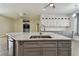 Bright kitchen with a large island, stainless steel appliances, and an open concept design, great for entertaining at 9709 Bay Colony Dr, Riverview, FL 33578