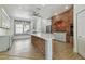 Kitchen featuring a large island with marble countertop and brick accents at 9709 Bay Colony Dr, Riverview, FL 33578