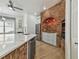 Kitchen featuring a large island with marble countertop, brick arch, and stainless appliances at 9709 Bay Colony Dr, Riverview, FL 33578