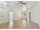 Bright living room with hardwood floors, modern ceiling fan, and neutral paint at 9709 Bay Colony Dr, Riverview, FL 33578
