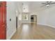 Bright living room featuring hardwood floors, a chandelier, and an open floor plan at 9709 Bay Colony Dr, Riverview, FL 33578