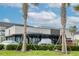 Image of a Starbucks building with palm trees in front of it at 9795 Crescent Ray Dr, Wesley Chapel, FL 33545