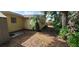 Backyard with mature trees, providing ample shade at 9805 110Th Ln, Seminole, FL 33772