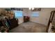 Bedroom with carpeting and windows at 9805 110Th Ln, Seminole, FL 33772