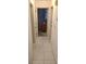 Hallway with tiled floor leading to rooms at 9805 110Th Ln, Seminole, FL 33772