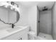 Updated bathroom with a walk-in shower, modern vanity, and updated fixtures at 9831 Scenic Dr, Port Richey, FL 34668