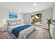 Stylishly furnished bedroom with modern decor, wood floors, and access to backyard at 9831 Scenic Dr, Port Richey, FL 34668
