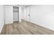 Bedroom featuring neutral walls, a closet and light colored flooring at 9831 Scenic Dr, Port Richey, FL 34668