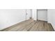 Neutral-toned room with clean white walls, trim and light colored flooring at 9831 Scenic Dr, Port Richey, FL 34668