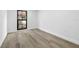 Bare bedroom with clean walls, baseboards and light colored flooring at 9831 Scenic Dr, Port Richey, FL 34668