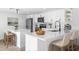 Beautiful kitchen featuring white cabinets, stainless steel appliances, and quartz countertops at 9831 Scenic Dr, Port Richey, FL 34668