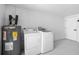 Laundry room with washer, dryer and water heater at 9831 Scenic Dr, Port Richey, FL 34668