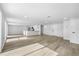 Open concept living area featuring new wood floors, an island countertop, and access to the kitchen at 9831 Scenic Dr, Port Richey, FL 34668