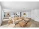 Stylishly furnished living room with modern decor, wood floors, and an open floor plan at 9831 Scenic Dr, Port Richey, FL 34668