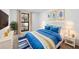 Staged main bedroom featuring decor, a large window and furniture at 9831 Scenic Dr, Port Richey, FL 34668