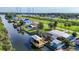 Aerial view of canal-front home with dock, pool, and scenic surroundings at 9929 Bay Dr, Gibsonton, FL 33534