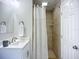 Renovated bathroom with new shower, modern vanity, and tiled floors at 9929 Bay Dr, Gibsonton, FL 33534
