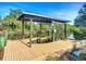 Private boat dock with lift on the canal providing convenient access to the water and stunning natural scenery at 9929 Bay Dr, Gibsonton, FL 33534