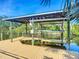 Boat dock and lift on the canal perfect for enjoying waterfront activities and convenient boat storage at 9929 Bay Dr, Gibsonton, FL 33534