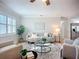 Inviting living room featuring plantation shutters, hardwood floors, and neutral decor, perfect for relaxing or entertaining at 9929 Bay Dr, Gibsonton, FL 33534
