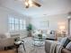 Comfortable living room with lots of natural light, stylish furnishings, and hardwood floors at 9929 Bay Dr, Gibsonton, FL 33534