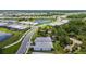 Expansive aerial view of a Primary-planned community, showcasing the scenic lakes and meticulously landscaped homes at 10036 Beachwalk Dr, Englewood, FL 34223