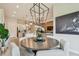 Open-concept dining area offers a kitchen and living space view, perfect for entertaining at 10036 Beachwalk Dr, Englewood, FL 34223