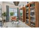 Bright seating area with stylish furnishings, cabinets, and a captivating chandelier at 10036 Beachwalk Dr, Englewood, FL 34223