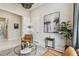 Intimate seating with modern decor, artwork, and a large indoor plant creates a tranquil ambiance at 10036 Beachwalk Dr, Englewood, FL 34223
