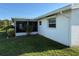 Lush backyard featuring a screened-in patio, with a well maintained lawn at 10169 45Th N St, Pinellas Park, FL 33782