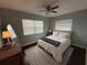 Bright bedroom featuring a decorative carpet, a window, and a ceiling fan at 10169 45Th N St, Pinellas Park, FL 33782