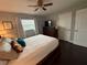 Comfortable bedroom with ceiling fan, a window, and white bedding at 10169 45Th N St, Pinellas Park, FL 33782