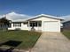 Charming single-story home featuring a garage, well-maintained lawn, and appealing curb appeal at 10169 45Th N St, Pinellas Park, FL 33782