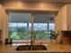 Kitchen window view featuring granite countertops, modern faucet, and peaceful outdoor scenery at 10169 45Th N St, Pinellas Park, FL 33782