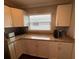 Bright kitchen with ample granite counter space, stainless steel appliances, and white cabinetry at 10169 45Th N St, Pinellas Park, FL 33782