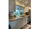 Bright kitchen with granite countertops, stainless steel appliances, and a view of the backyard at 10169 45Th N St, Pinellas Park, FL 33782