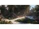 Beautiful zen garden with lush greenery, a stream, and a tranquil seating area at 1028 Sunset Point Rd # R4, Clearwater, FL 33755