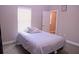 Cozy bedroom featuring natural light from the window and a comfortable bed at 10431 Alcon Blue Dr, Riverview, FL 33578