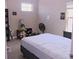 Neutral bedroom featuring a window and simple decorations at 10431 Alcon Blue Dr, Riverview, FL 33578