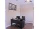 Comfortable home office with black desk and chair at 10431 Alcon Blue Dr, Riverview, FL 33578
