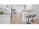 Beautiful kitchen with white cabinets, stainless steel appliances and a kitchen island at 1052 55Th N Ave, St Petersburg, FL 33703