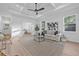 Bright living room with a decorative ceiling, ceiling fan, neutral colored rug, and stylish decor at 1052 55Th N Ave, St Petersburg, FL 33703