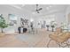 Bright living room with a decorative ceiling, ceiling fan, neutral colored rug, and stylish decor at 1052 55Th N Ave, St Petersburg, FL 33703