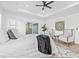 Bright main bedroom with plenty of natural light, wood floors, and a stylish en-suite bathroom at 1052 55Th N Ave, St Petersburg, FL 33703