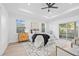 Bright main bedroom with plenty of natural light, wood floors, and a stylish en-suite bathroom at 1052 55Th N Ave, St Petersburg, FL 33703