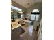 Relaxing primary bathroom with tiled floors, dual sinks, a soaking tub, and lots of natural light from large windows at 10532 Cory Lake Dr, Tampa, FL 33647