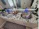 Bathroom featuring double vessel sinks with a granite countertop and a large mirror at 10532 Cory Lake Dr, Tampa, FL 33647